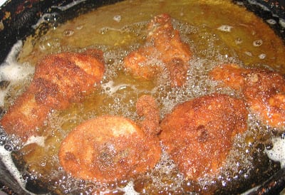 Frying chicken in hot oil